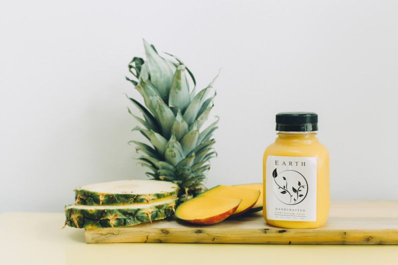Organic Products - slice pinepple and earth bottle